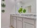 Double vanity bathroom with granite countertops and modern fixtures at 437 Caraway Dr, Kissimmee, FL 34759