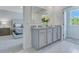 Modern bathroom with double vanity and granite countertop at 437 Caraway Dr, Kissimmee, FL 34759