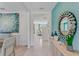 Bright and airy entryway with a large mirror and view into the living area at 437 Caraway Dr, Kissimmee, FL 34759