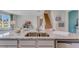 Kitchen island with granite countertop, double sink, and dishwasher at 437 Caraway Dr, Kissimmee, FL 34759