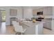 Modern kitchen with granite countertops, stainless steel appliances, and an island at 437 Caraway Dr, Kissimmee, FL 34759