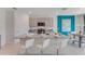 Modern kitchen with stainless steel appliances and a granite island with seating at 443 Caraway Dr, Kissimmee, FL 34759