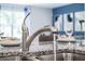 Modern kitchen sink and faucet with granite countertops at 528 Nogales Ct, Kissimmee, FL 34758