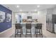 Modern kitchen with white cabinets, granite counters, and stainless steel appliances at 528 Nogales Ct, Kissimmee, FL 34758