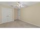 Bedroom with double doors and ceiling fan at 6163 Froggatt St, Orlando, FL 32835