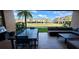 Private patio with outdoor seating, large table, and built-in grill at 7451 Brooklyn Dr, Kissimmee, FL 34747