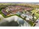 Aerial view of community with pool, tennis courts, and numerous residences at 8939 Bismarck Palm Rd, Kissimmee, FL 34747