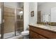 Clean bathroom with shower, granite vanity, and toilet at 8939 Bismarck Palm Rd, Kissimmee, FL 34747