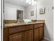 Double vanity bathroom with granite countertop and large mirror at 8939 Bismarck Palm Rd, Kissimmee, FL 34747