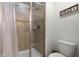 Shower stall with glass enclosure and neutral tile at 8939 Bismarck Palm Rd, Kissimmee, FL 34747