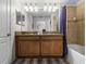 Clean bathroom with double vanity and shower/tub combo at 8939 Bismarck Palm Rd, Kissimmee, FL 34747