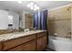 Bathroom boasts double sinks, granite countertop, and bathtub at 8939 Bismarck Palm Rd, Kissimmee, FL 34747