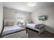 Cozy bedroom with two twin beds and a window at 8939 Bismarck Palm Rd, Kissimmee, FL 34747