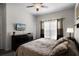 Bright bedroom with a comfortable bed and TV at 8939 Bismarck Palm Rd, Kissimmee, FL 34747