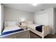 Bedroom with two twin beds, nightstands, and TV at 8939 Bismarck Palm Rd, Kissimmee, FL 34747