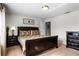 Well-lit bedroom featuring a double bed and nightstands at 8939 Bismarck Palm Rd, Kissimmee, FL 34747