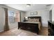 Spacious bedroom with a large bed, window, and dresser at 8939 Bismarck Palm Rd, Kissimmee, FL 34747