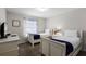 Bedroom featuring two twin beds, a dresser, and window at 8939 Bismarck Palm Rd, Kissimmee, FL 34747