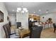 Elegant dining room with a glass table and leather chairs at 8939 Bismarck Palm Rd, Kissimmee, FL 34747