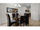 Modern dining room featuring a glass-top table and six chairs at 8939 Bismarck Palm Rd, Kissimmee, FL 34747