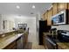 Open concept kitchen with granite counters at 8939 Bismarck Palm Rd, Kissimmee, FL 34747