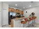 Modern kitchen with breakfast bar and seating at 8939 Bismarck Palm Rd, Kissimmee, FL 34747