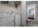 Convenient laundry room with washer, dryer, and extra storage at 8939 Bismarck Palm Rd, Kissimmee, FL 34747