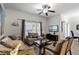 Spacious living room with ample seating and large window at 8939 Bismarck Palm Rd, Kissimmee, FL 34747
