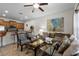 Open living room featuring a cozy sofa and kitchen views at 8939 Bismarck Palm Rd, Kissimmee, FL 34747