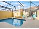 Screened-in private plunge pool with lounge chairs at 8939 Bismarck Palm Rd, Kissimmee, FL 34747
