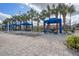 Relaxing cabanas with lounge chairs around the pool area at 8939 Bismarck Palm Rd, Kissimmee, FL 34747