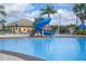 Refreshing pool with a waterslide for  at 8939 Bismarck Palm Rd, Kissimmee, FL 34747