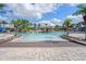 Inviting pool area with a rock grotto and water features at 8939 Bismarck Palm Rd, Kissimmee, FL 34747