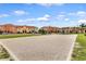 Outdoor sand volleyball court with residential buildings in background at 8939 Bismarck Palm Rd, Kissimmee, FL 34747