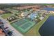 Aerial view of tennis and basketball courts near pool at 8939 Bismarck Palm Rd, Kissimmee, FL 34747