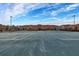 Tennis court with residential buildings in background at 8939 Bismarck Palm Rd, Kissimmee, FL 34747