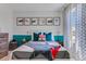Bright bedroom with shark-themed decor and plenty of natural light at 11124 Amber Ridge Dr, Zellwood, FL 32798