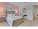Bedroom with a light pink wall and built-in desk area at 11124 Amber Ridge Dr, Zellwood, FL 32798