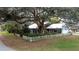 Quaint home, surrounded by lush landscaping at 1215 Timberidge Dr, Lakeland, FL 33809