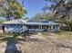 Spacious backyard with solar panels and patio at 1215 Timberidge Dr, Lakeland, FL 33809