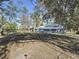 Large backyard with a view of the home's back at 1215 Timberidge Dr, Lakeland, FL 33809
