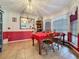 Bright dining room with red tablecloth and built-in shelving at 1215 Timberidge Dr, Lakeland, FL 33809