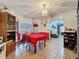 Cozy dining area with red accents and wooden chairs at 1215 Timberidge Dr, Lakeland, FL 33809
