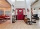 Inviting entryway with a charming red door and high ceilings at 1215 Timberidge Dr, Lakeland, FL 33809