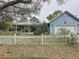 Cute blue house with white picket fence at 1215 Timberidge Dr, Lakeland, FL 33809