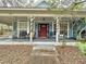 Charming home with a spacious front porch and seating at 1215 Timberidge Dr, Lakeland, FL 33809