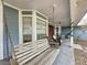 Peaceful front porch with wooden swing at 1215 Timberidge Dr, Lakeland, FL 33809