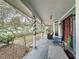 Relaxing front porch with rocking chairs and a swing at 1215 Timberidge Dr, Lakeland, FL 33809