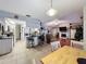 Open floor plan connecting kitchen and living room with hardwood floors at 1215 Timberidge Dr, Lakeland, FL 33809