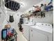 Laundry room with washer, dryer, and shelving at 1215 Timberidge Dr, Lakeland, FL 33809